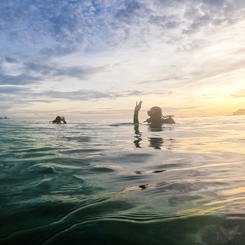 Divers signaling O.K. before the ascend in Pemuteran Bay
